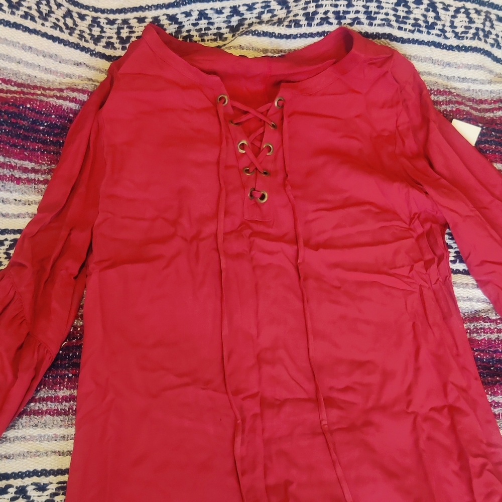 JustFab (L) red dress or top for a woman.